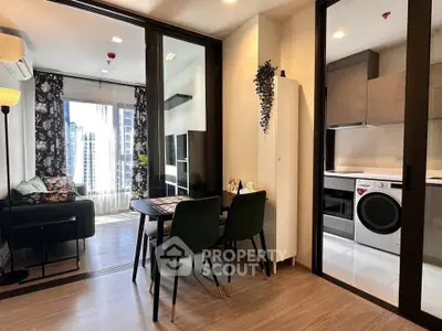 Modern apartment interior with open living room and kitchen, featuring stylish decor and natural light.