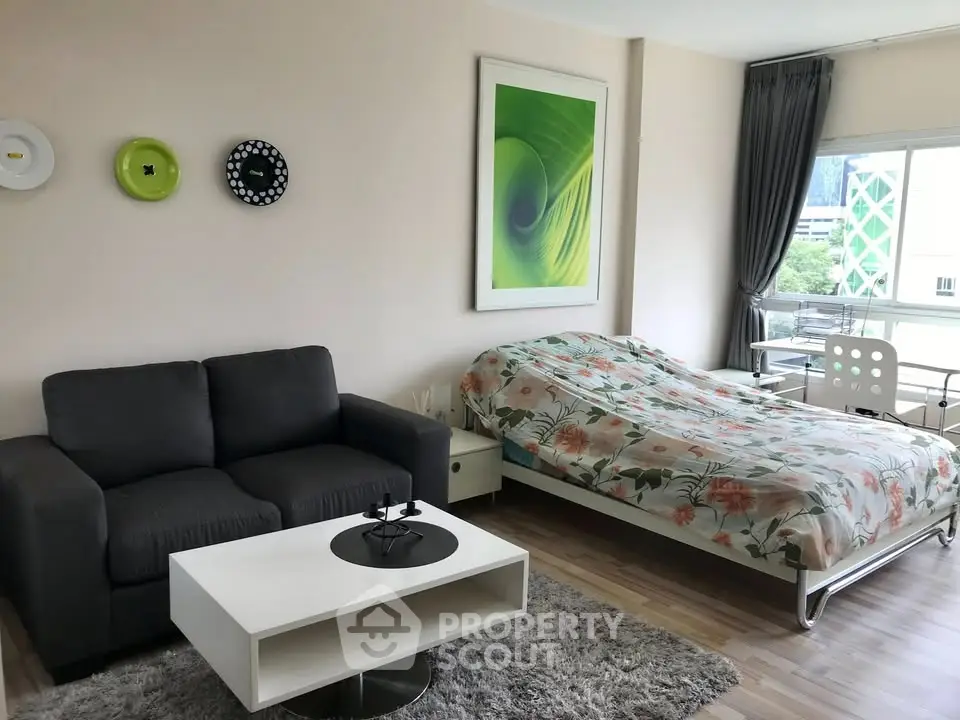 Modern studio apartment with cozy living area and stylish decor