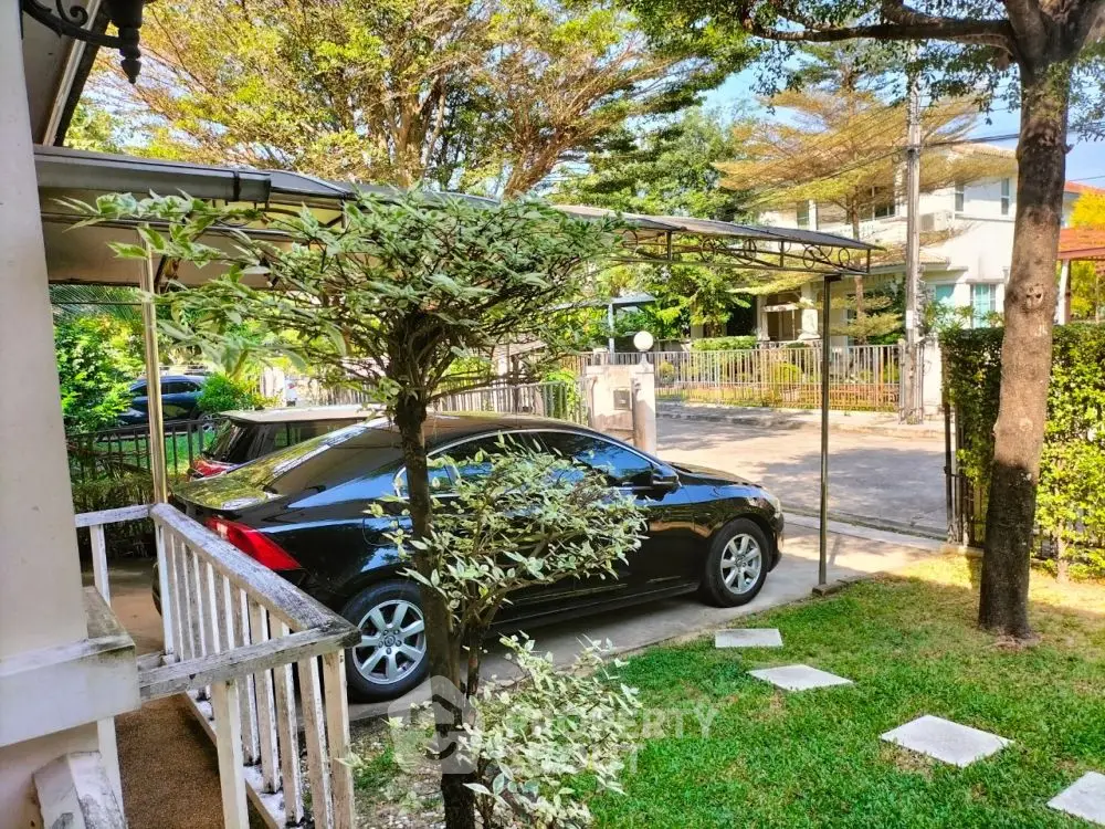 Charming suburban home with lush garden and carport, perfect for family living.
