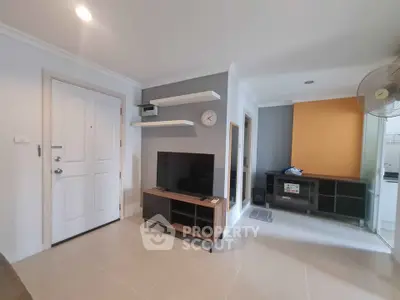 Modern living room with sleek TV stand and wall shelves in stylish apartment