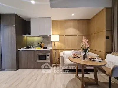 Modern open-plan kitchen and cozy living area with stylish decor