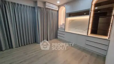 Modern living room with elegant built-in storage and soft lighting