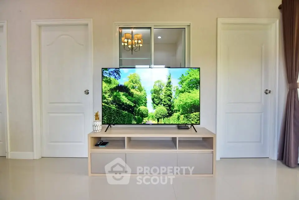 Modern living room with sleek TV setup and elegant decor