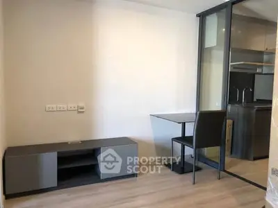 Modern apartment interior with sleek kitchen and minimalist furniture
