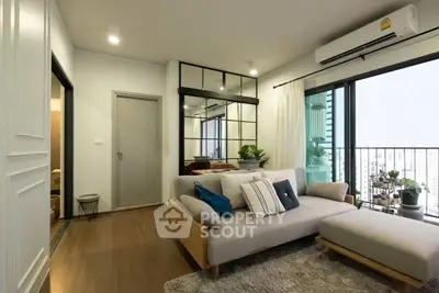 Modern living room with stylish decor and balcony view