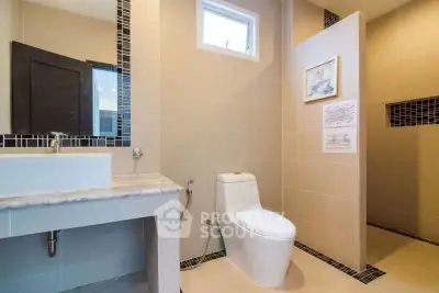 Modern bathroom with sleek design and elegant fixtures in a contemporary home.