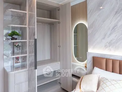 Luxurious bedroom with elegant open wardrobe and stylish decor