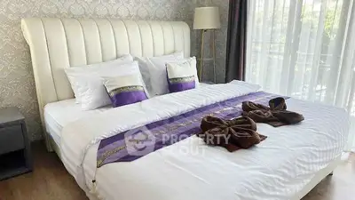 Luxurious bedroom with elegant decor and large window view