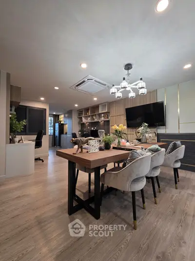 Stylish modern living room with elegant dining area and contemporary decor.