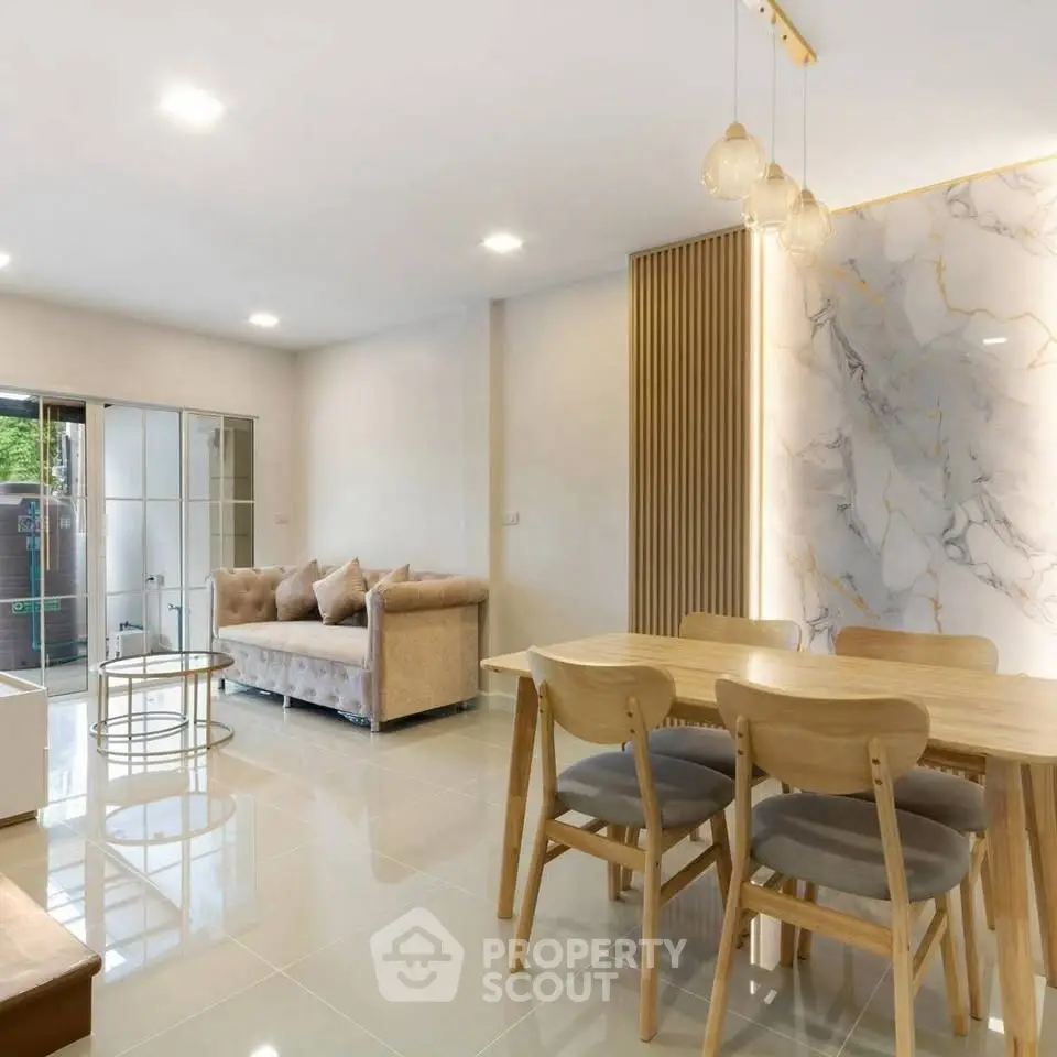 Spacious modern living room with elegant dining area and stylish decor