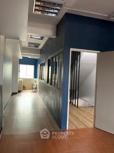 Spacious office corridor with modern design and natural light