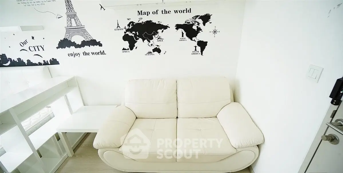 Cozy living room with world map wall art and white sofa