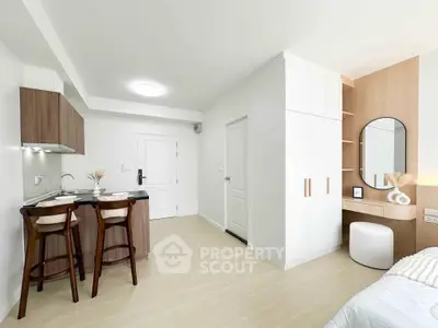 Modern studio apartment with stylish kitchen and cozy living area