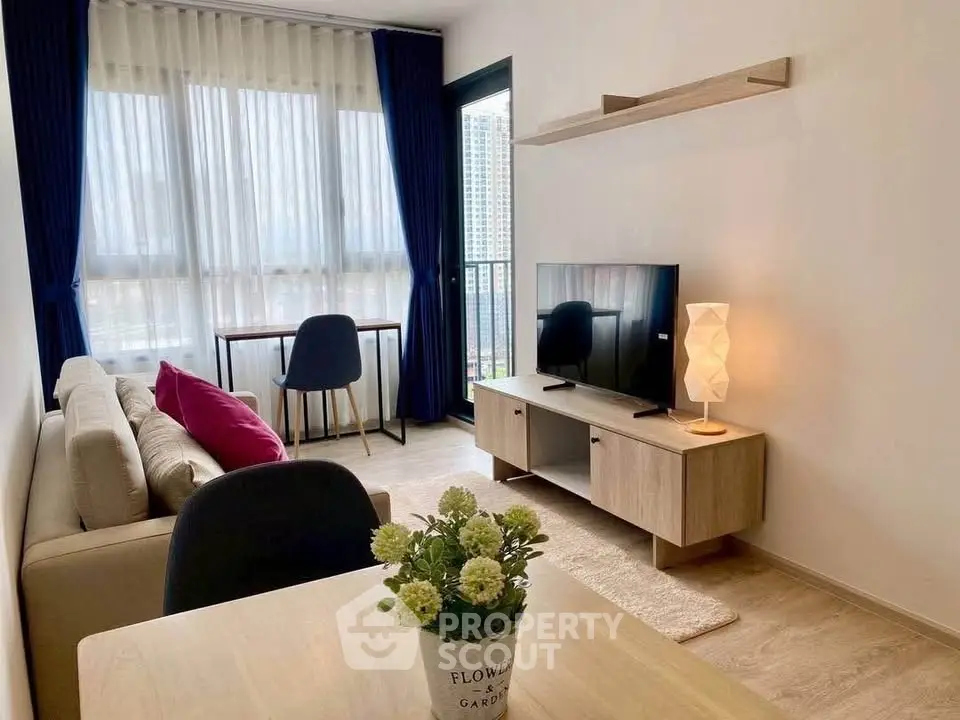 Modern living room with stylish furniture and large window view