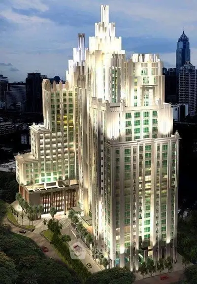 Stunning illuminated skyscraper with art deco design in urban skyline, showcasing luxury living.
