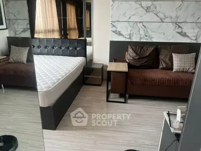 Modern bedroom with stylish decor and comfortable furnishings in a contemporary apartment.