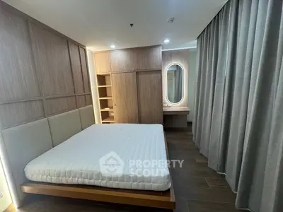 Modern bedroom with wooden accents and built-in wardrobe