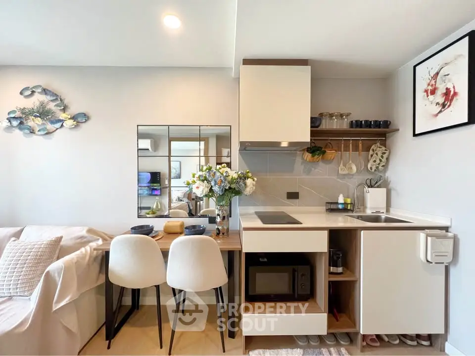 Modern compact kitchen with dining area and stylish decor