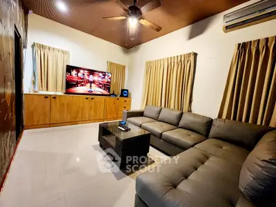 Spacious living room with modern sectional sofa and entertainment center