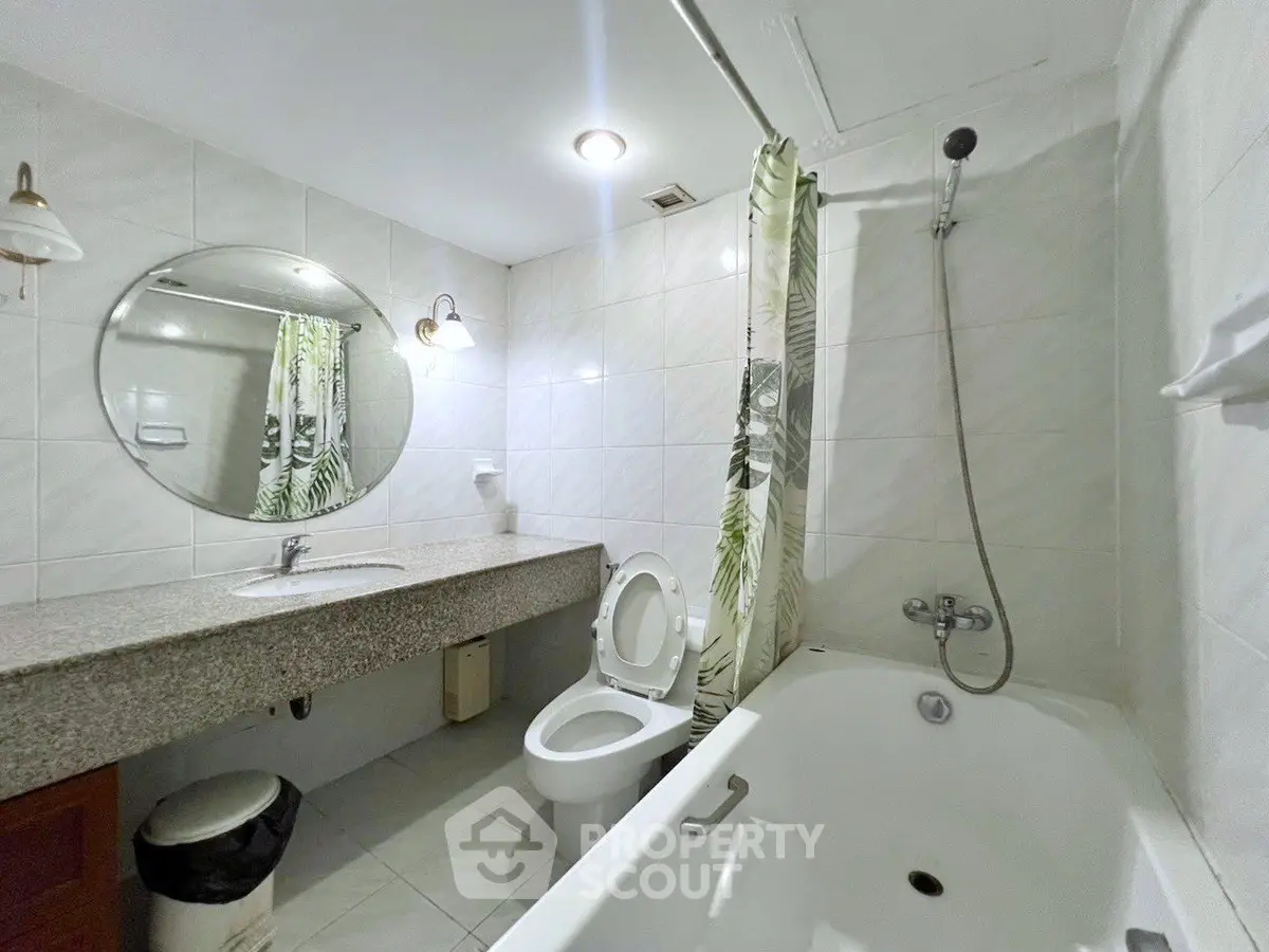 Modern bathroom with bathtub and elegant tile design