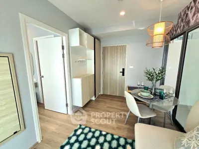 Modern living room with stylish decor and dining area in a contemporary apartment.