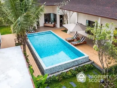 Luxurious villa with private pool and lush garden, perfect for relaxation and entertainment.