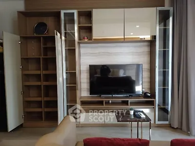 Modern living room with stylish TV unit and open shelving, perfect for contemporary urban living.