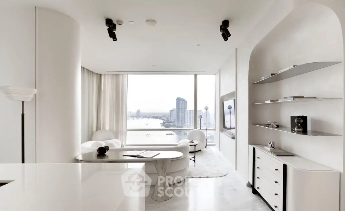 Luxurious modern living room with panoramic city view and elegant white decor.