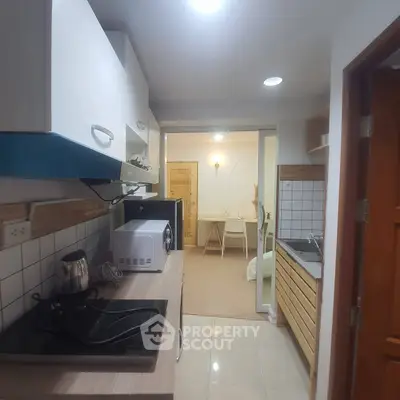 Cozy kitchen with modern appliances and open layout in a stylish apartment