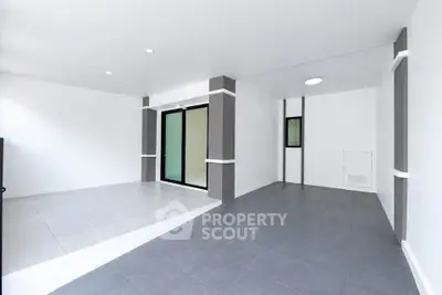 Spacious modern interior with sleek tile flooring and large windows