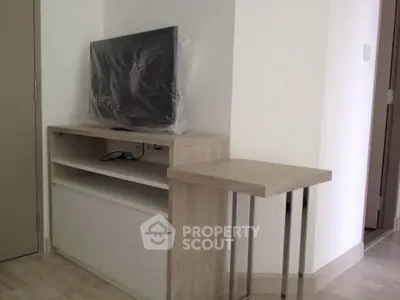 Modern living room corner with TV stand and sleek side table