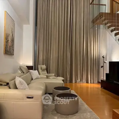 Luxurious living room with high ceilings and elegant decor