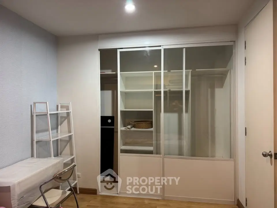 Modern bedroom with sliding closet doors and minimalist decor