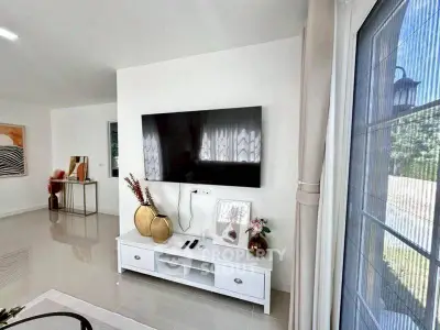Modern living room with sleek TV setup and elegant decor
