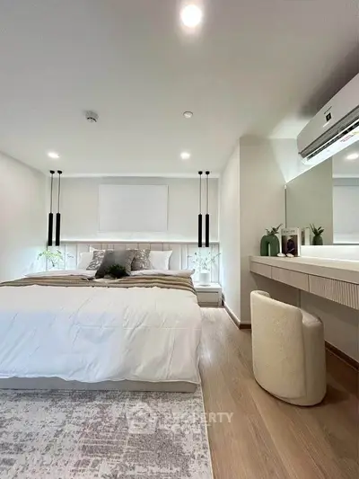 Modern bedroom with stylish decor and cozy ambiance, featuring a comfortable bed and elegant lighting.