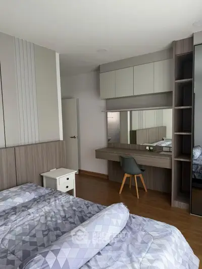 Modern bedroom with stylish decor and built-in vanity desk