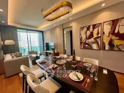 Luxurious open-plan living and dining area with elegant decor and city view balcony.