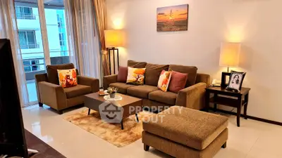 Cozy living room with modern decor and large windows for natural light.