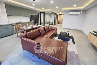 Spacious modern living room with open kitchen and stylish furniture