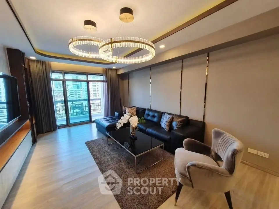Luxurious modern living room with elegant lighting and city view balcony.
