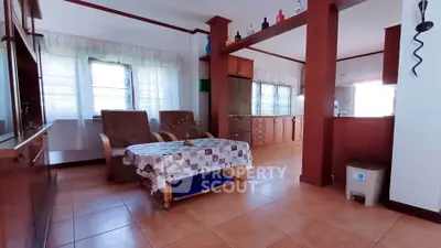 Spacious living room with open kitchen layout and natural light
