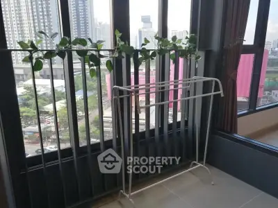 Modern apartment balcony with city view and decorative plants