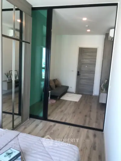 Modern bedroom with mirrored wardrobe and stylish decor