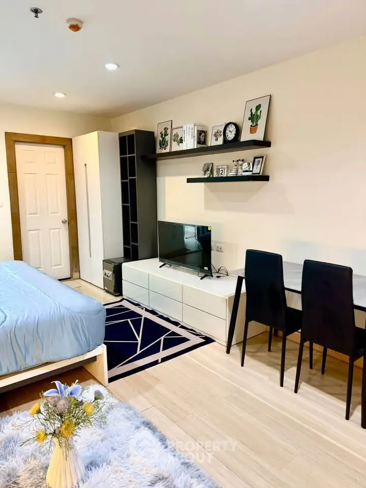 Modern studio apartment with stylish decor and cozy living space