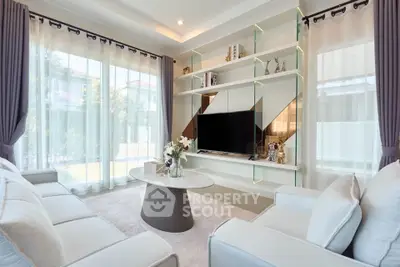 Luxurious living room with elegant decor and large windows for natural light