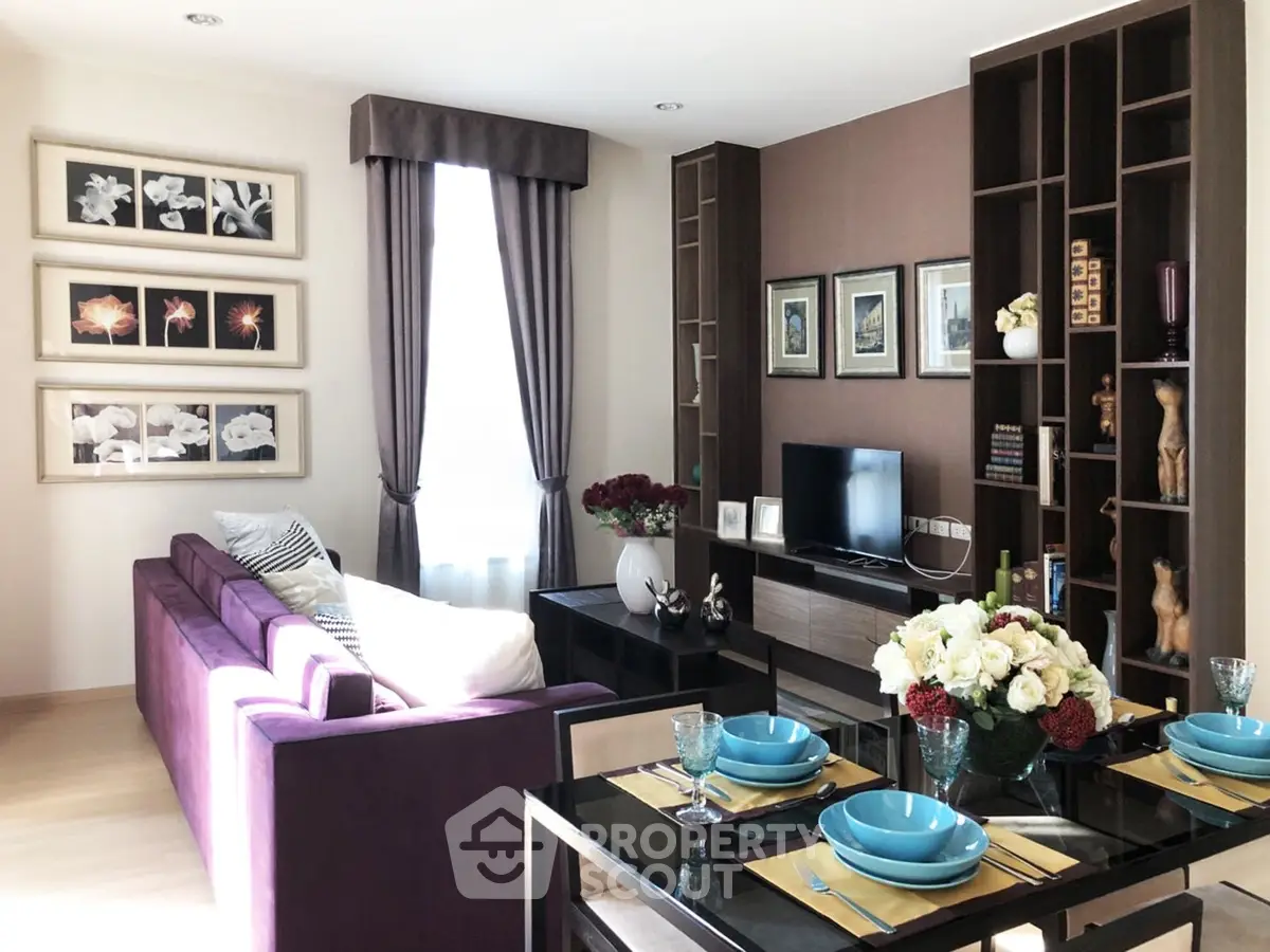 Stylish modern living room with elegant decor and vibrant purple sofa