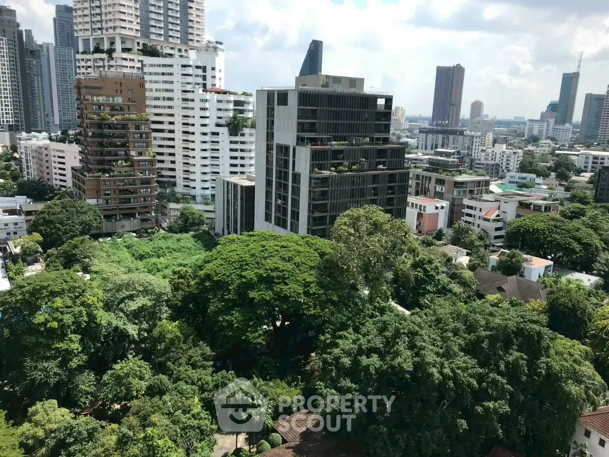 Stunning cityscape view with lush greenery and modern high-rise buildings, perfect for urban living.