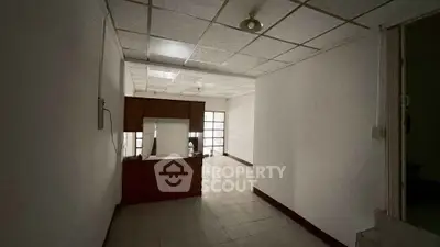 Spacious office space with natural light and tiled flooring, ideal for business setup.