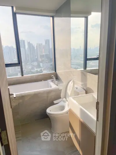 Luxury bathroom with city view featuring bathtub and modern fixtures