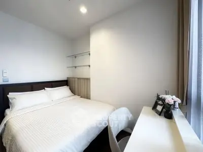 Cozy modern bedroom with white linens and natural light